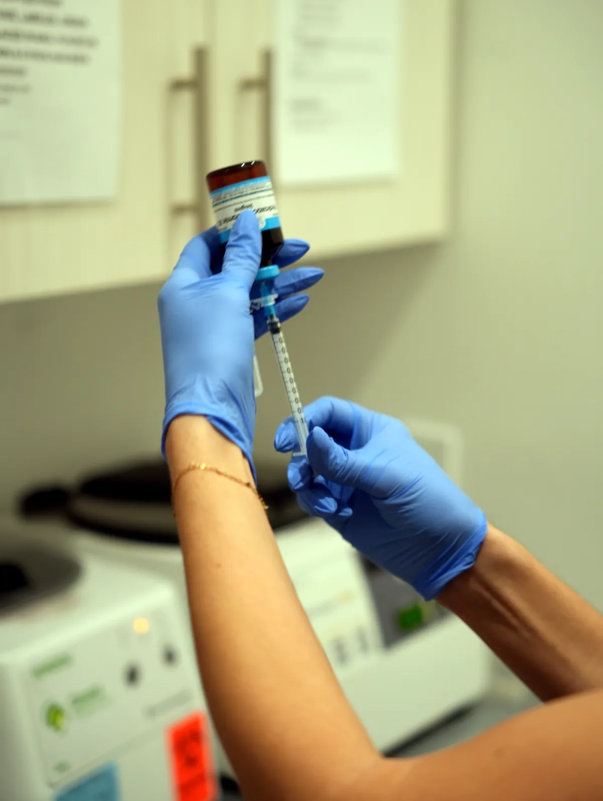 Provider drawing up an injection at Balanced Health & Wellness