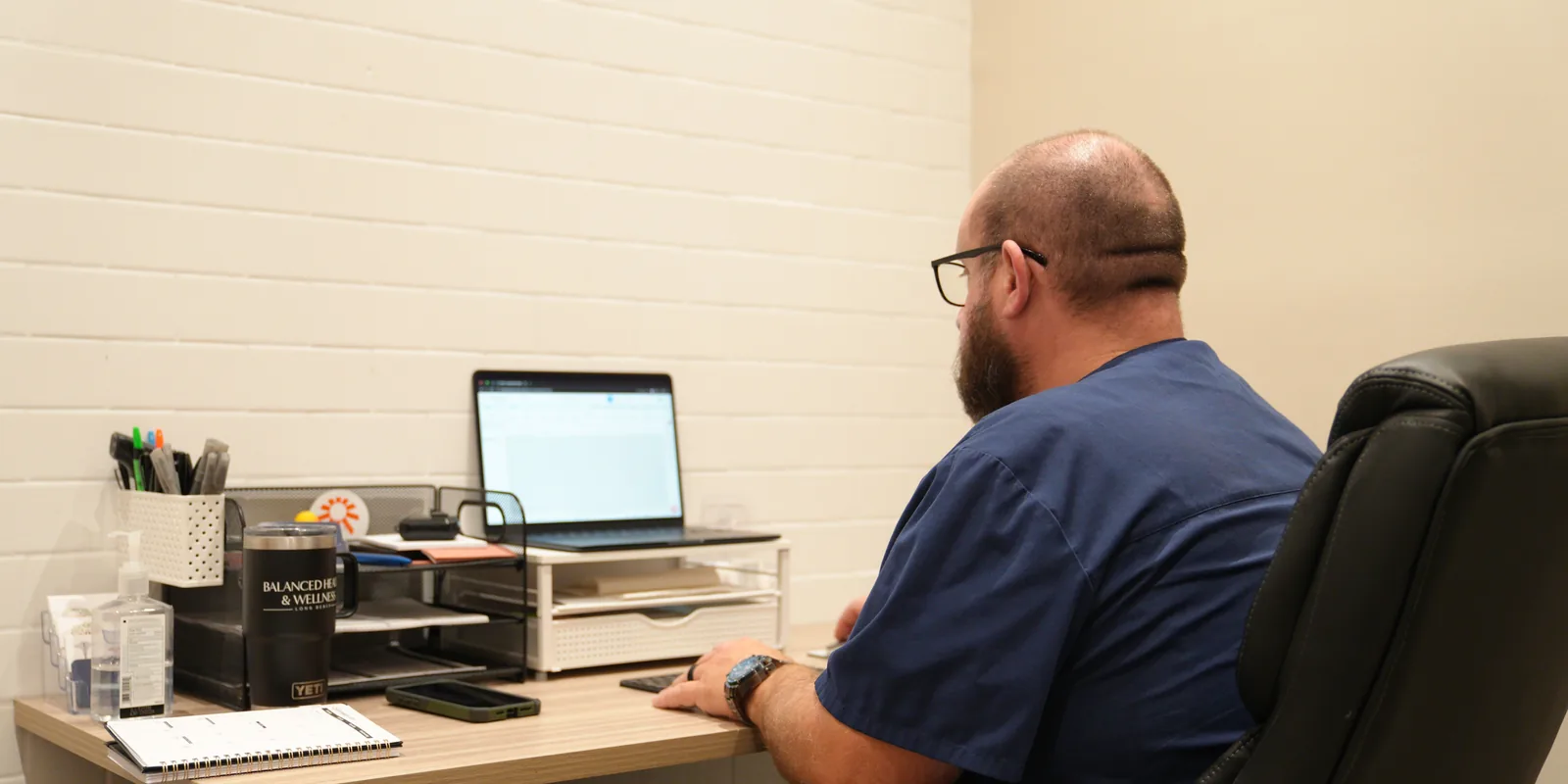 Dan Gottfried, FNP-BC, at his desk at Balanced Health & Wellness